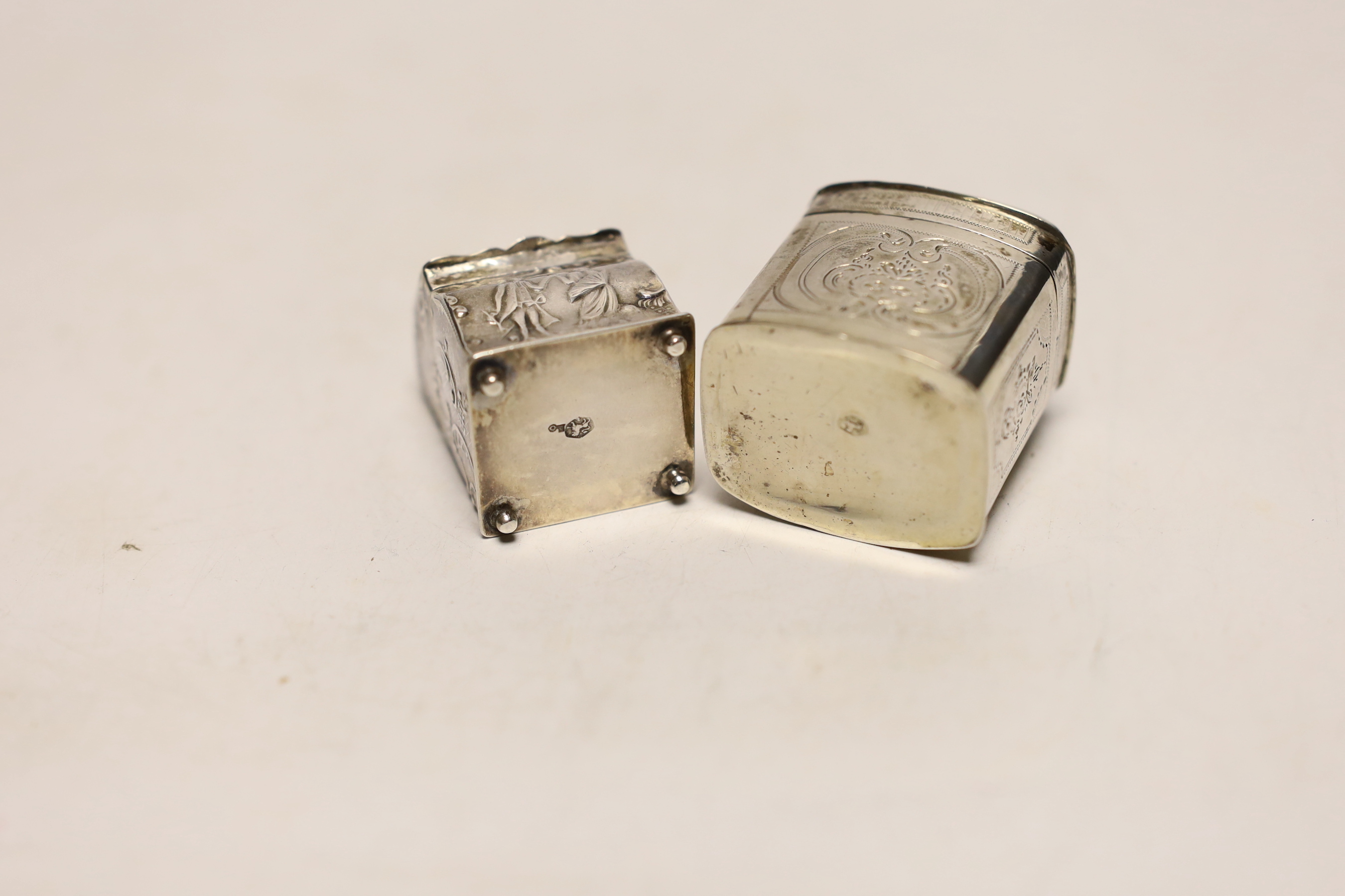 Two 19th century Dutch white metal snuff boxes, one of bureau form, on ball feet, 39mm.